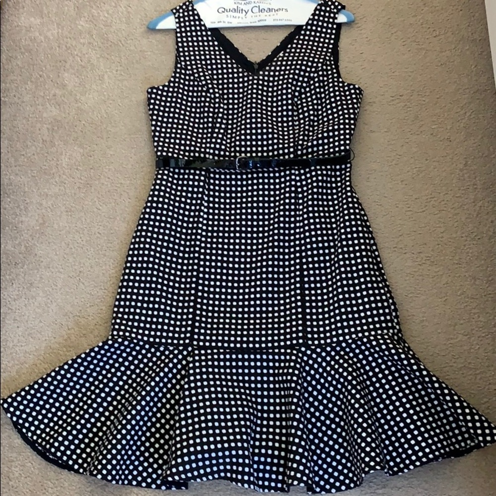 Belted black and white sleeveless dress